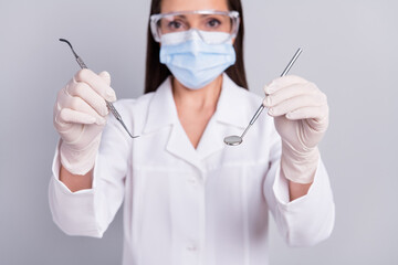 Cropped photo of mature woman clinic doctor dentistry medicine therapy equipment isolated over grey color background