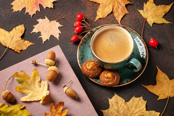 Naklejka na ściany i meble Autumn background with cup of black coffee and fall decoration