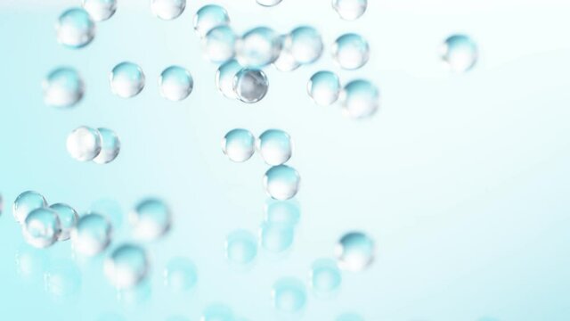 Super slow motion of falling blue hydrogel balls. Cosmetic, youth and beauty concept. Filmed on high speed cinema camera, 1000fps
