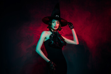 Photo of adorable sexy mysterious woman wear gothic witch dress hand arm headwear isolated red fog...