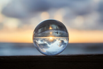 Magic sphere. Fortune teller, mind power concept. Crystal Ball reflecting water and sky.