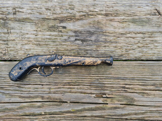 The Dueling pistol. Old pistol. Medieval weapons.