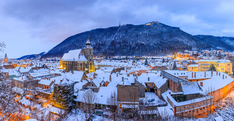 Brasov, Romania. Panoramic view of the old town and Tampa mountain in winter season. - obrazy, fototapety, plakaty