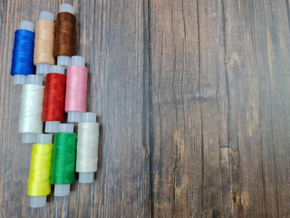 Fototapeta na wymiar The Multicolored sewing threads. A set of sewing threads.