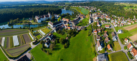 Aerial view of the city and monastery Rheinau in Switzerland on a sunny morning day in summer.