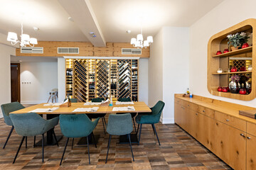 Interior of a luxury restaurant with wooden wine shelf