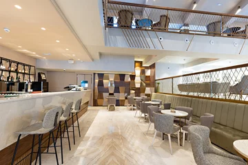 Fotobehang Hotel chique Interior of a spacious cafe bar in hotel lobby  © rilueda