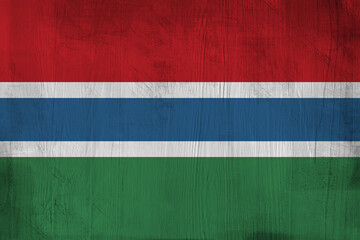 Patriotic wooden background in color of  Gambia flag