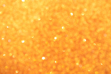 Abstract yellow blurred bokeh background. Glitter shining lights. Festive and celebration backdrop for holiday, christmas and new year design