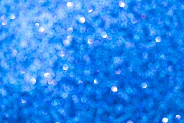 Naklejka na ściany i meble Abstract blue blurred bokeh background. Glitter shining lights. Festive and celebration backdrop for holiday, christmas and new year design, stock photo