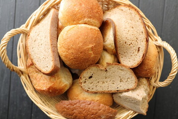 a basket with dry old rolls and bread 