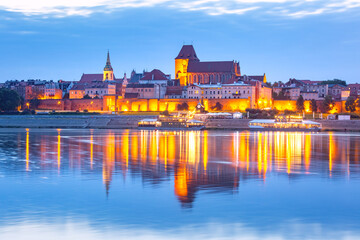 Fototapeta na wymiar Evening panorama of Old Town of Torun seen from the Vistula, Poland