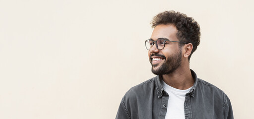 Closeup portrait of handsome smiling young man. Laughing joyful cheerful men isolated studio shot. Panoramic banner - Powered by Adobe