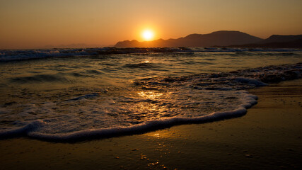 Spawning place of Caretta Caretta turtles: Iztuzu beach. Golden sun rays reflecting off the sea at sunset. Spectacular sunset at the meeting point of the Mediterranean and Aegean.