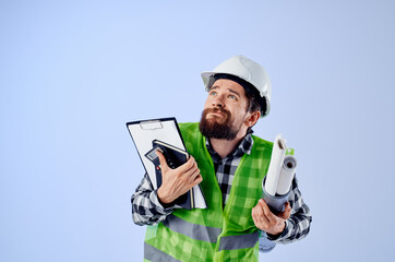 engineer with documents and drawings blueprints blue background