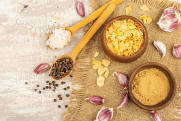 Fototapeta na wymiar Fresh garlic and its products: dried chunks and powder