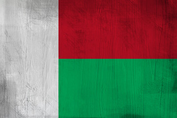 Patriotic wooden background in color of Madagascar flag