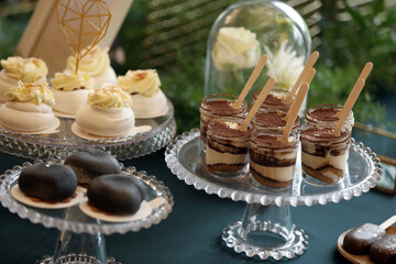 Tiramisu traditional Italian dessert in a glass on a catering table