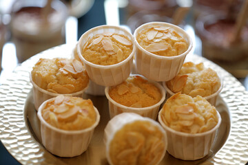 Tasty almond cupcakes on the stand