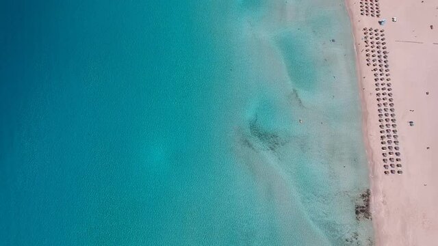 Aerial view of Simos beach in Elafonisos island in Greece. Elafonisos is a small Greek island the Peloponnese with idyllic exotic beaches and crystal clear waters. Laconia, Greece, Europe