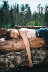 a girl in a beautiful lingerie corset in the forest, magazine photo