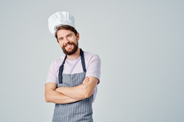 man in chef's uniform emotions hand gestures professional light background