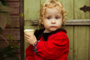 the child eats ice cream