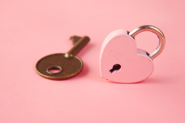 Pink Heart Shape Padlock And Key on table 