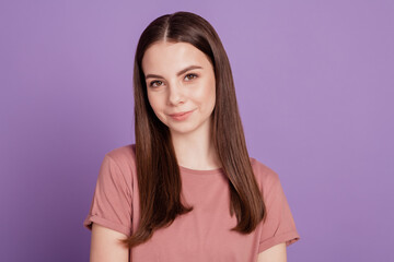 Fototapeta premium Photo of young sweet smiling girl isolated on purple background