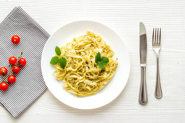 Italian pasta fettuccine with cream sauce and herbs