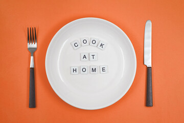 Conceptual photo, table setting with an empty plate, with one of the principles of healthy living - 