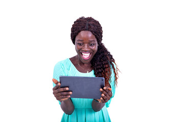 beautiful happy young woman looking at screen of digital tablet while smiling.