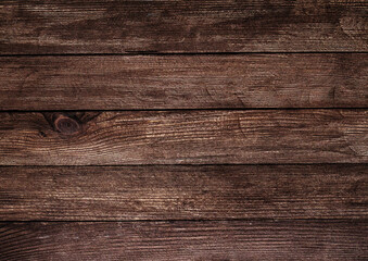 Vintage brown wood background texture with knots and nail holes.
