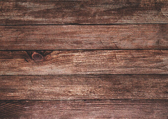 Vintage brown wood background texture with knots and nail holes.