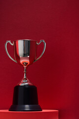 Close up classic trophy on the red background
