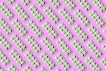 Pill pattern on a pink background