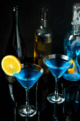 TWO GLASSES WITH DINK CURAÇAU BLUE DECORATED WITH ORANGE