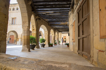 Fototapeta na wymiar People in Church; Square; Horta de Sant Joan; Tarragona