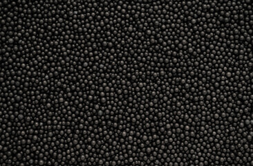 Abstract black foam beads texture background