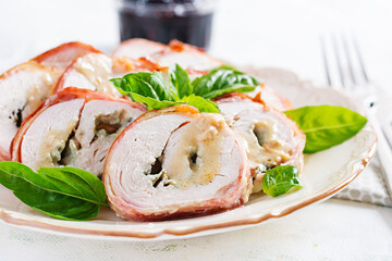 Baked chicken rolls with basil and cheese on  plate. Healthy lunch. Keto diet.