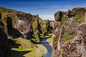 Fototapeta na wymiar Fjadrargljufur canyon with river and big rocks. South Iceland