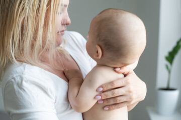 happy mother holding her baby