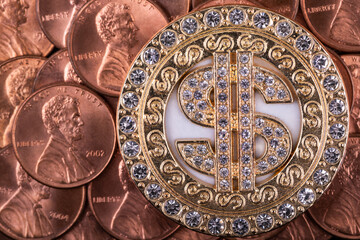 Gold plated medallion with pseudo-precious stones and dollar symbol and American coins in denominations of 1 cent