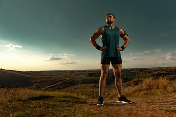 Athlete sprinter run. Strong athletic man running on sunset background wearing in the sportswear....
