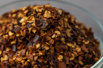 Dried chilli seed flakes macro close up