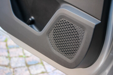 Speaker enclosure in a new car door