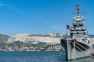 Cruiser Mikhail Kutuzov is museum ship. Close-up. Warship on pier against blurred background of...