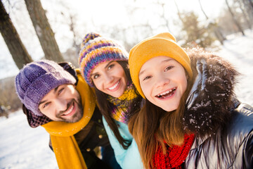 Photo of lovely family happy positive smile mom dad kid make selfie walk park winter enjoy time together