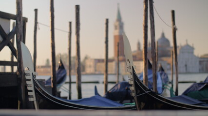 Fototapeta na wymiar Gondolas mooring in Venice, Italy