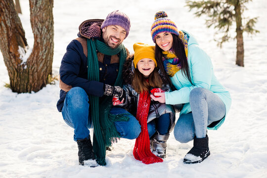 Full length photo of excited family happy positive smile mommy daddy daughter winter vacation trip outdoors